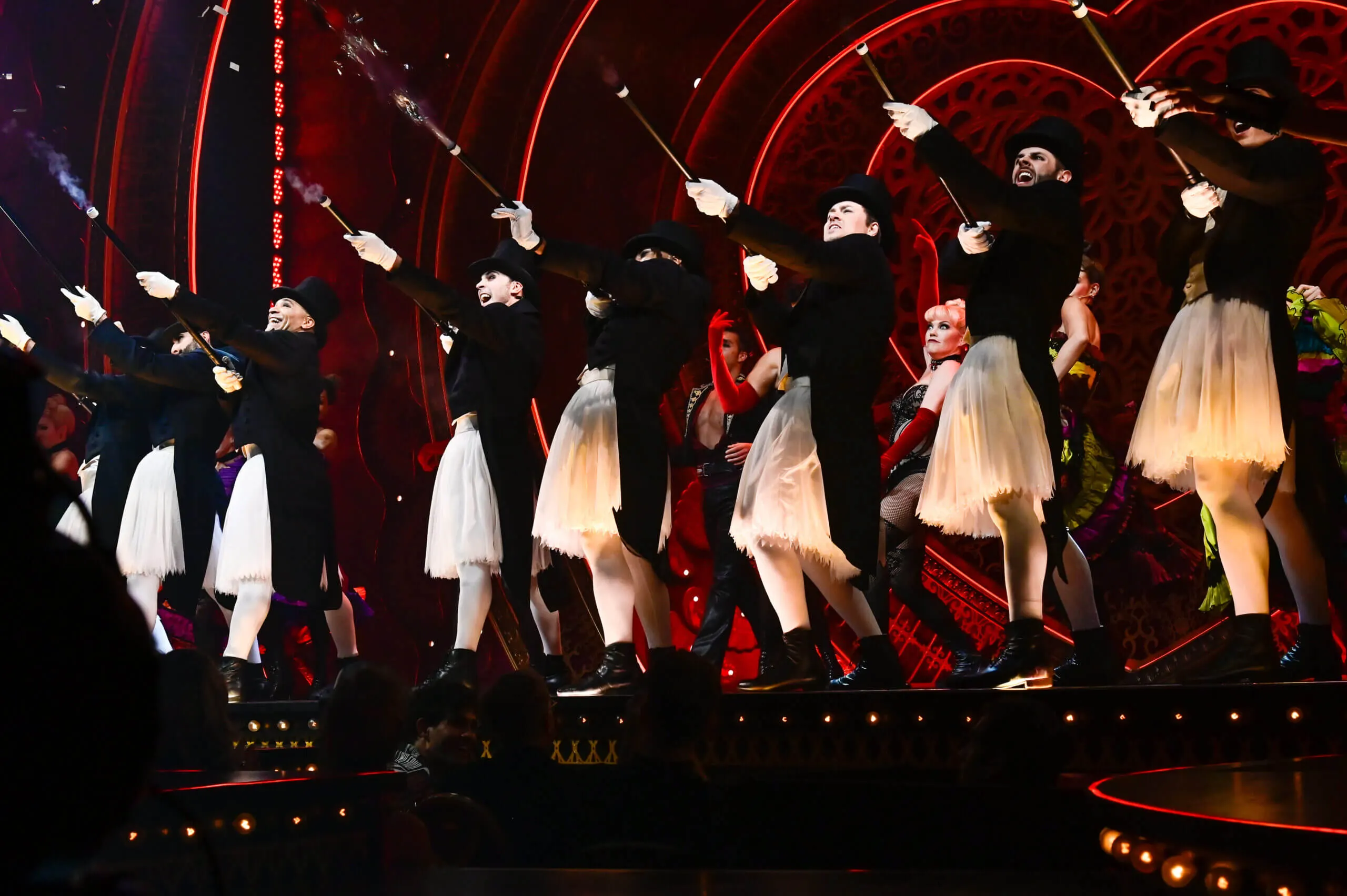 A group of gentlemen wearing male tutus in the Moulin Rouge musical finale
